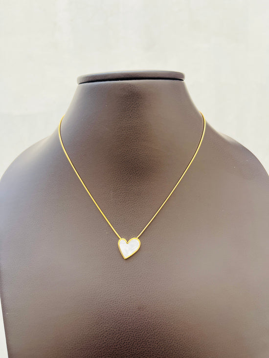 White enamel tilted heart necklace