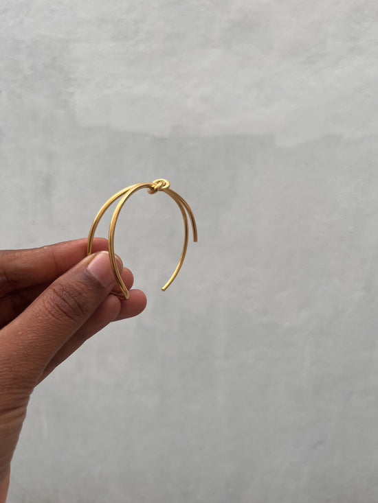 Knotted half open bracelet