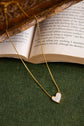 White enamel tilted heart necklace