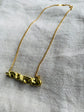 Melting gold bar pendant and gold coated chain