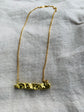 Melting gold bar pendant and gold coated chain